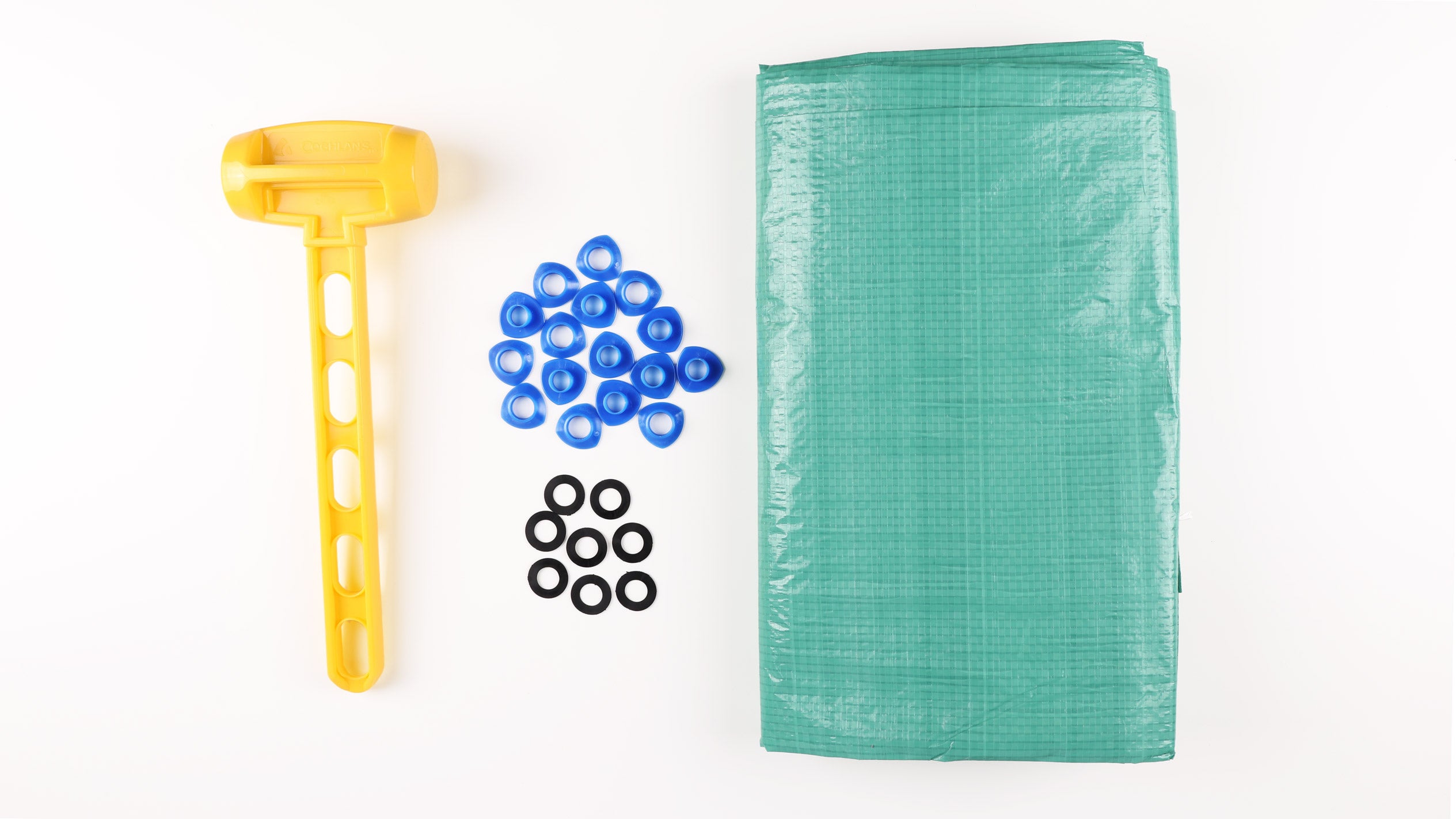 snap-in grommets, plastic mallet, and a green tarp.